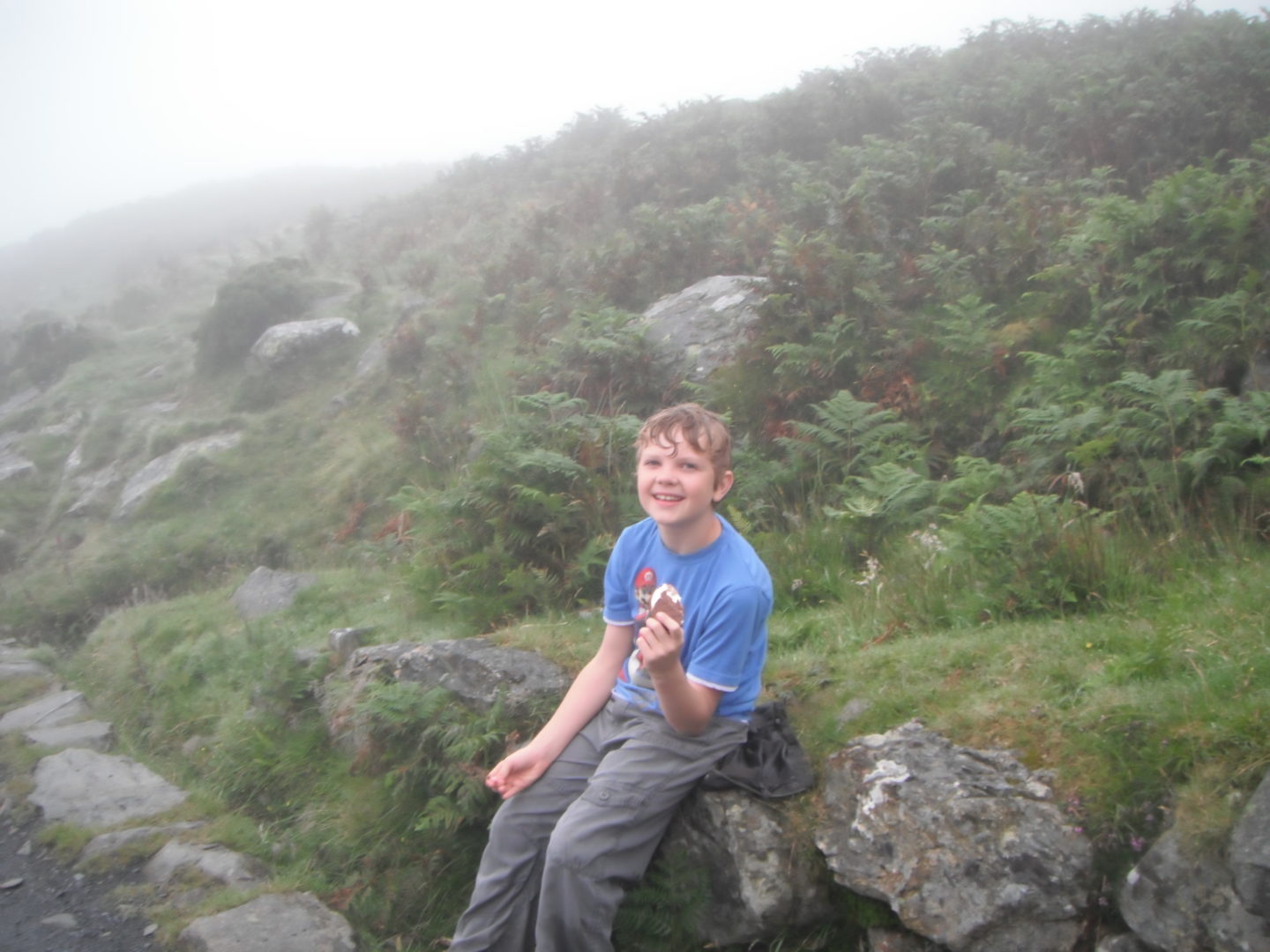 Lochlan resting on his Mount Snowdon climb