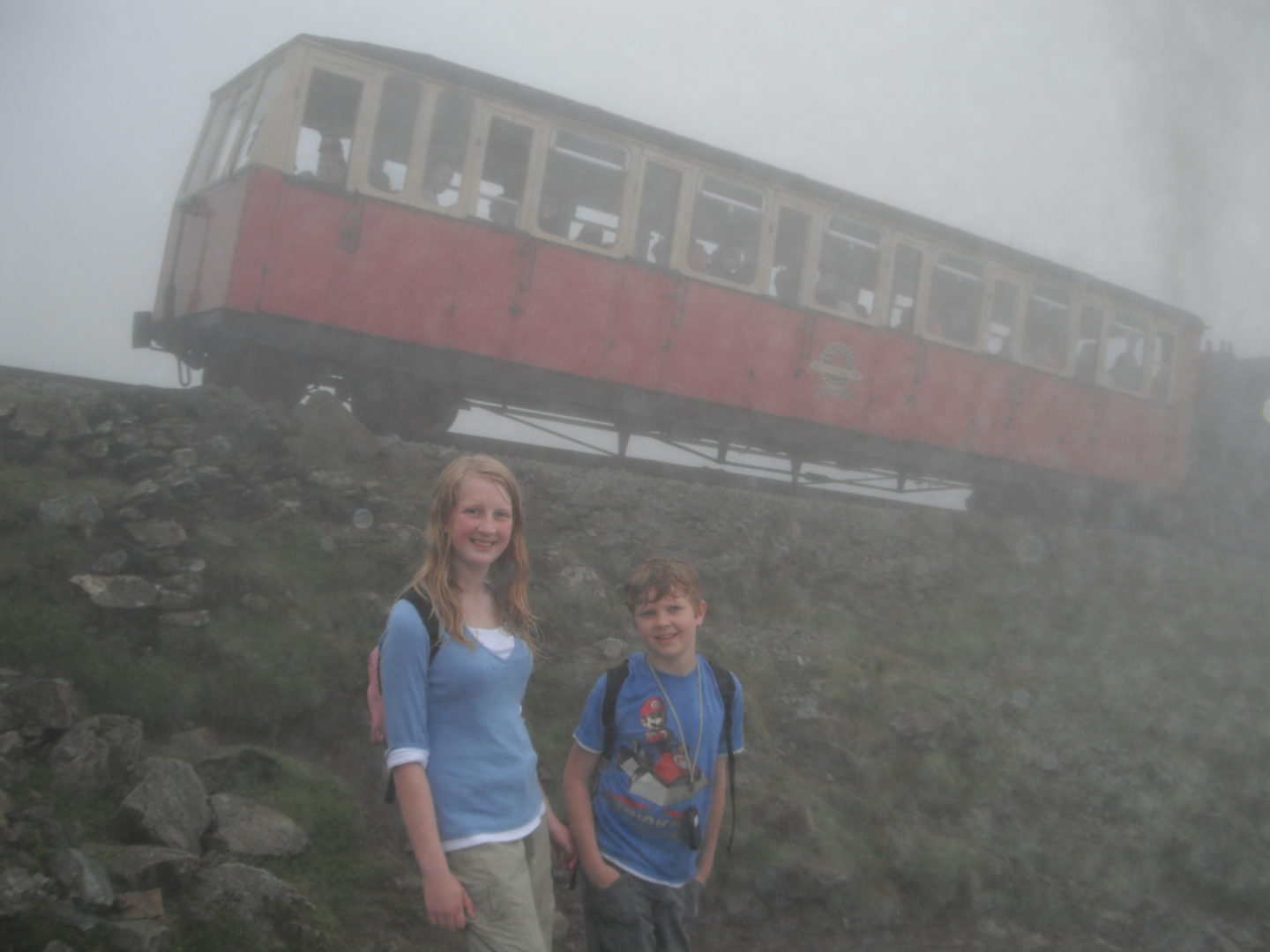 Xene and Lochlan with tyhe Mount Snowdon train in the background