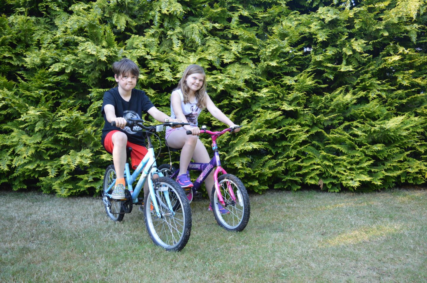 Kaide and Eowyn on Kids Mountain Bikes