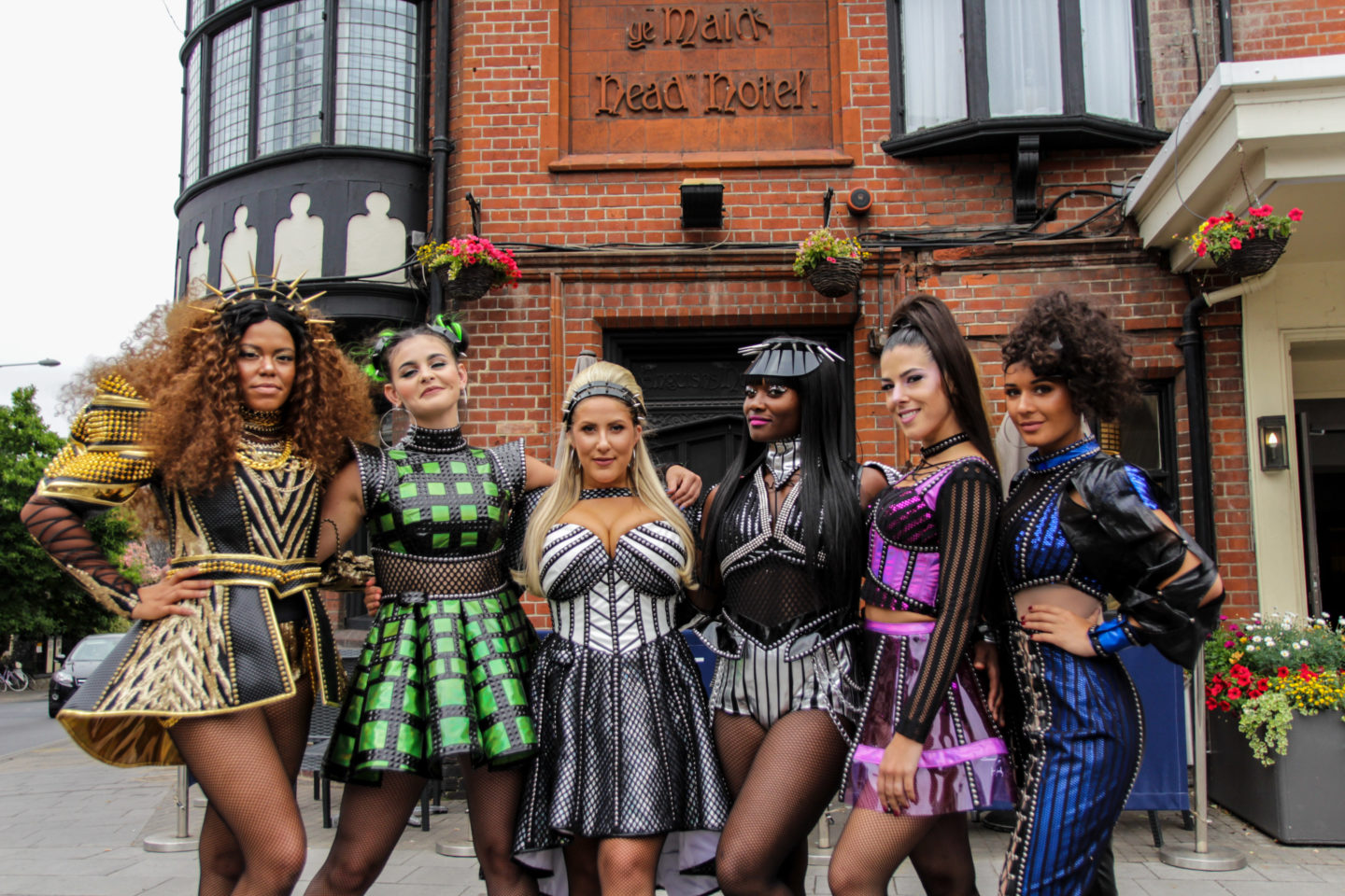 Six The Musical Cast members outside Maids Head Hotel Norwich