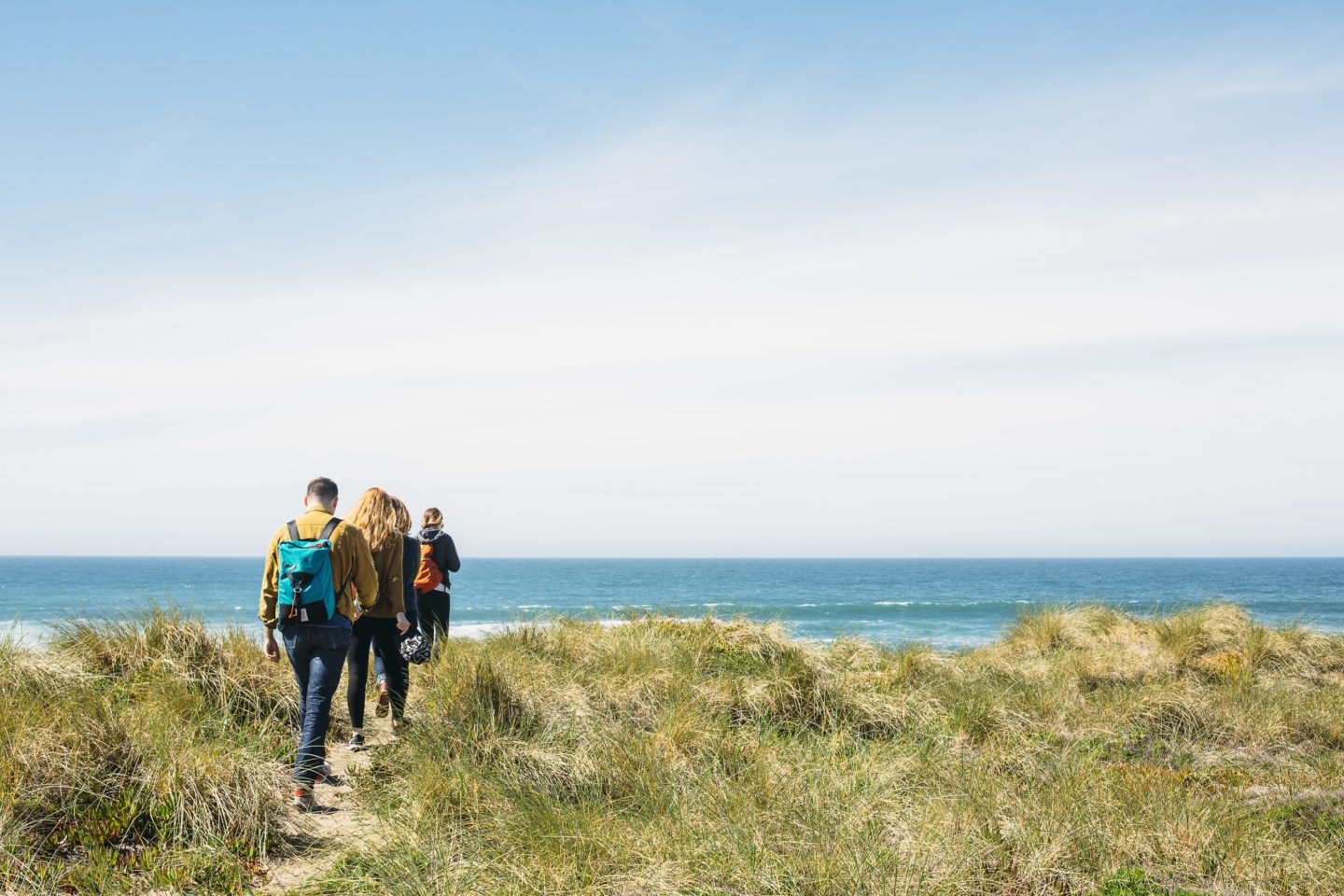 multi-generational travel walking along a coastal path