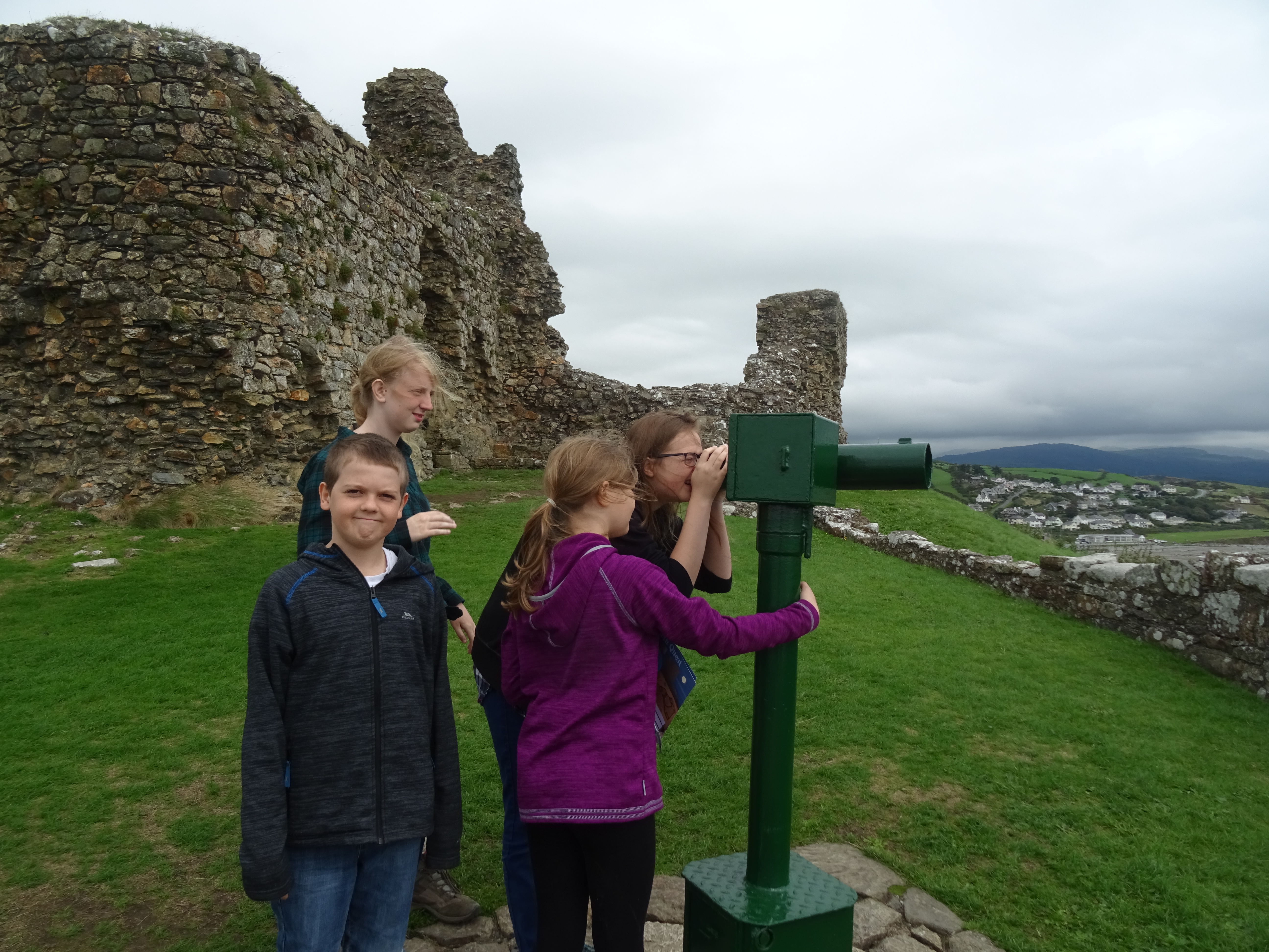 looking through the telescope at the top of Criccieth Castle