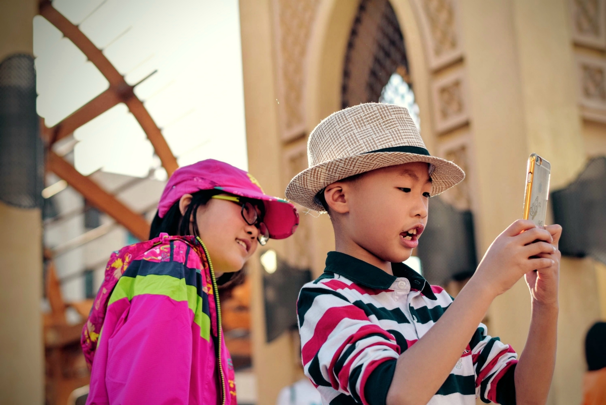 kids taking pics on phone in Sydney